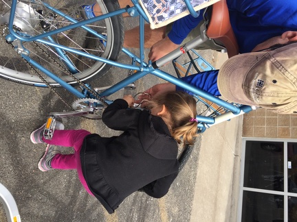 Helping daddy put a bottle cage on mommy s bike1